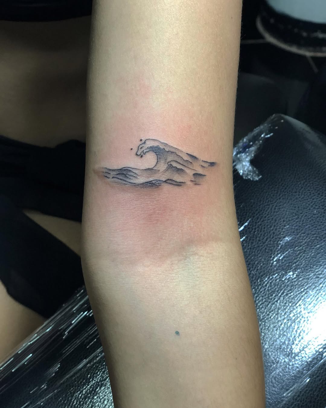Tiny wave tattoo